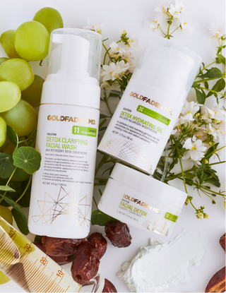 Close up image of products laying on fruit & greenery. 