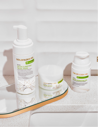 Detox & Clarify Collection product images on bathroom sink.